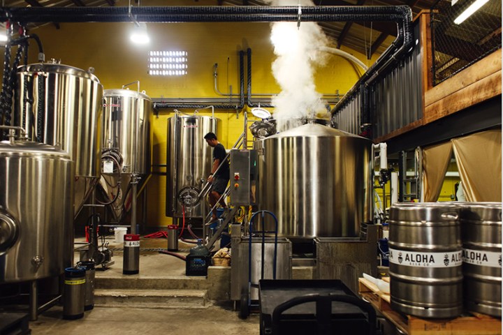 a large commercial kitchen with stainless steel appliances