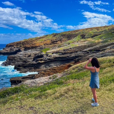 a little boy that is standing in the water
