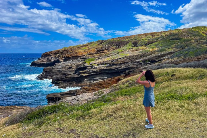 a little boy that is standing in the water